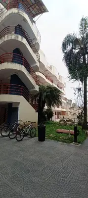 two bikes parked in front of a building at Complejo Aguaducho in Cordoba