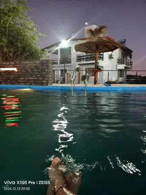 a person in the water in a swimming pool at DUPLEX Stadium in Tanti