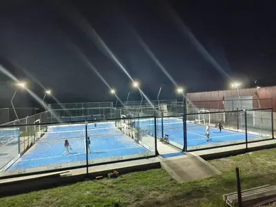 a group of people playing in a pool at night at DUPLEX Stadium in Tanti
