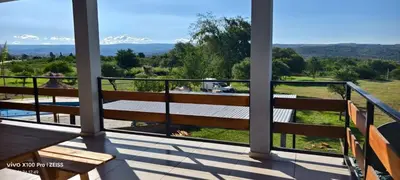 a balcony with benches and a view of the mountains at DUPLEX Stadium in Tanti