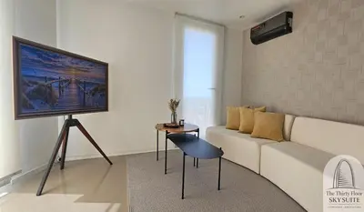 a living room with a couch and a table at The Thirty Floor Sky Suite in Cordoba