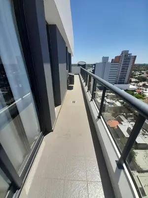a balcony with a view of a building at Departamento luminoso a 4 cuadras del centro in Río Cuarto