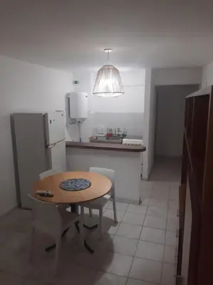 a kitchen with a table and a small table in it at Dpto 1 Ambiente Nva Cordoba, Capuchinos Buen Pastor in Cordoba
