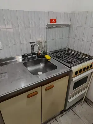 a kitchen with a sink and a stove at Dpto 1 Ambiente Nva Cordoba, Capuchinos Buen Pastor in Cordoba