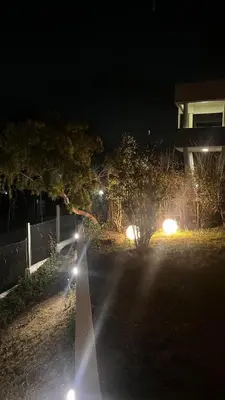 a street lit up at night with street lights at Casa- Villa Parque Siquiman in Villa Parque Siquiman