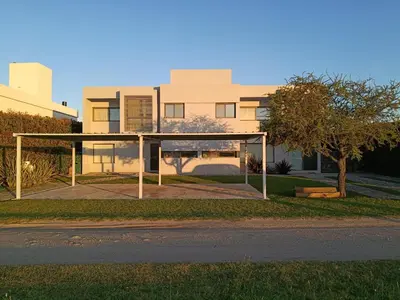 a house on the side of a street at Casa lago dique los molinos in La Estancia