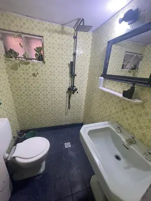 a bathroom with a toilet and a sink and a tub at Alquiler temporario en villa Carlos Paz in Villa Carlos Paz