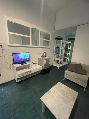 a living room with a tv and a couch at Alquiler temporario en villa Carlos Paz in Villa Carlos Paz