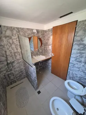 a bathroom with a sink and a toilet and a shower at Cabañas Colibri in Merlo