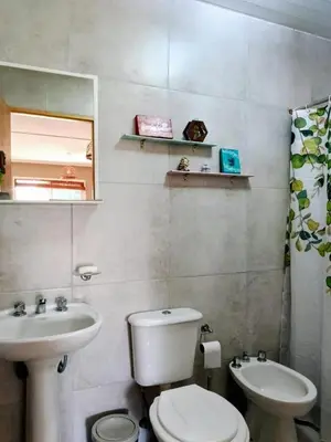 a bathroom with a toilet and a sink at La Berilde in La Población