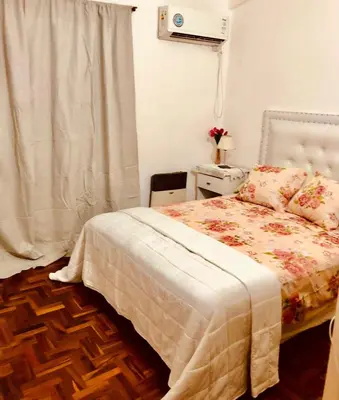 a small bedroom with a bed and a window at Habitación exclusiva Huéspedes con piscina , aire acondicionado y jardín en base doble, muy confortable in Cordoba