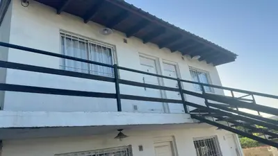 a balcony on the side of a building at Mi casa in Villa Carlos Paz