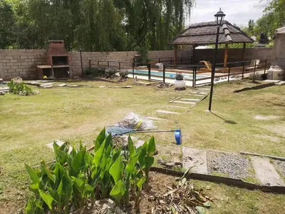 a garden with a gazebo in a yard at mi casita en tanti, casa 25 in Tanti