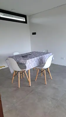 a table and two chairs in a room at Cabañas Chirivita Atos Pampa in Atos Pampa