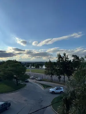a view of a parking lot with cars parked at Dpto a estrenar Villa Carlos Paz frente a la costanera in Villa Carlos Paz