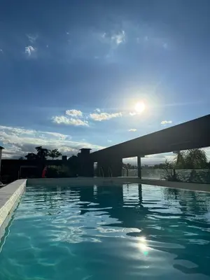 a swimming pool on the roof of a building at Dpto a estrenar Villa Carlos Paz frente a la costanera in Villa Carlos Paz