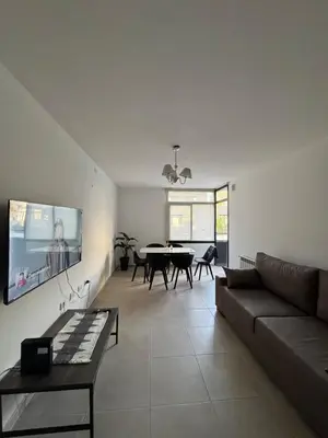 a living room with a couch and a table at Dpto a estrenar Villa Carlos Paz frente a la costanera in Villa Carlos Paz