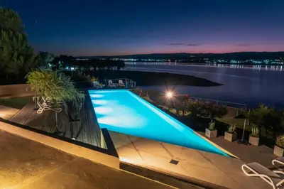 a swimming pool on a house with a view of the water at PUEBLO CHICO - casas de lago in Villa Ciudad de America