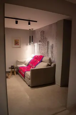 a bedroom with a bed with a red blanket on it at Departamento Córdoba Centro in Cordoba
