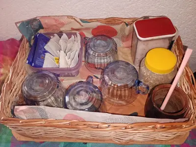 a basket with dishes and other items in it at Casita feliz in Villa del Dique