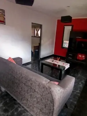 a living room with a couch and a table at El Paraiso 1 in Villa Carlos Paz