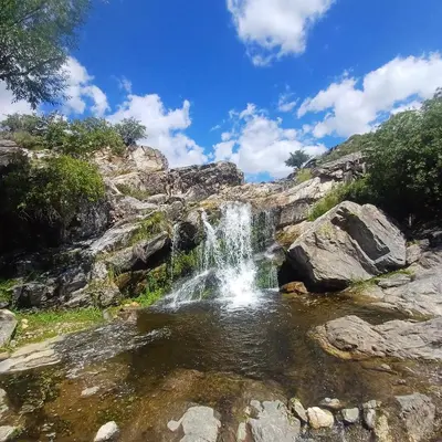 a waterfall in a pool of water at las huertitas de milele in La Porteña