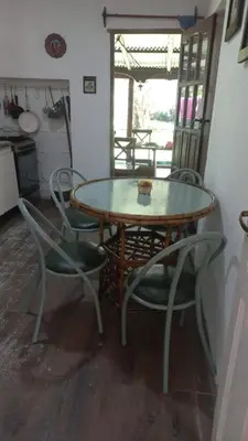 a table and chairs and a table and a table and chairs at El descanso in Panaholma
