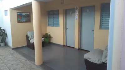 a room with two doors and a pillar in a building at JM brochero in Villa Cura Brochero