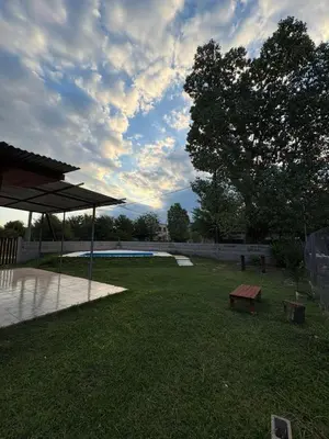 a park with a picnic table and a bench at Las tres lunas 2 in Villa Anizacate