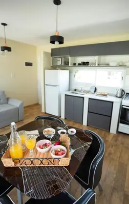 a kitchen with a table with a tray of food on it at En Gracia, tu casa de Montaña in Alta Gracia
