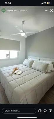 a large white bed in a room with a ceiling at En Gracia, tu casa de Montaña in Alta Gracia