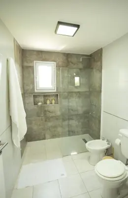 a bathroom with a shower and a toilet at En Gracia, tu casa de Montaña in Alta Gracia