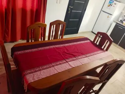 a wooden table with a red table cloth on it at Berna in Carpintería