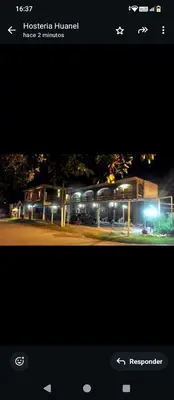 a picture of a building with lights at night at Hostería Huanel in Villa Cura Brochero
