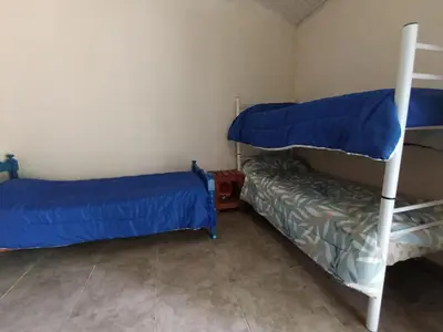 a room with two bunk beds and a couch at Hostel 2 in Pilar