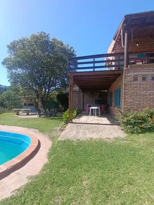 a view of a house with a swimming pool at Casa Mirta in Villa Carlos Paz