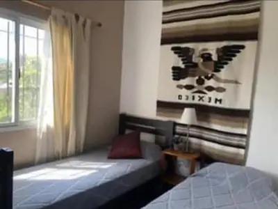 a bedroom with a bed and a window at Vito in Villa Carlos Paz