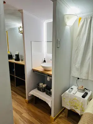 a small bathroom with a sink and a mirror at Complejo de cabañas Munay Ki in Santa Rosa de Calamuchita