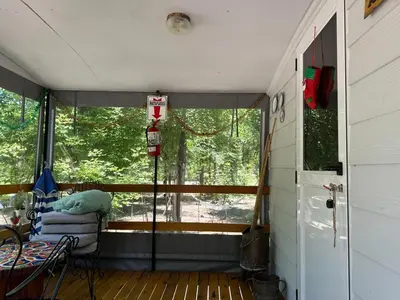 a screened in porch of a house with a window at Complejo de cabañas Munay Ki in Santa Rosa de Calamuchita