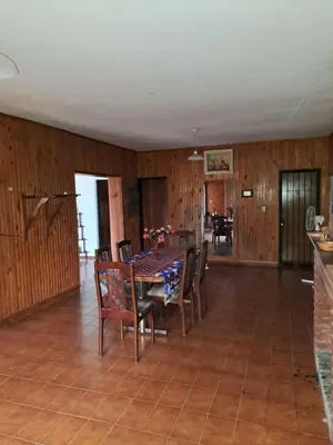 a dining room with a table and chairs at Complejo calle Córdoba in Mina Clavero