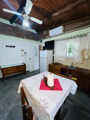 a kitchen with a table with a candle on it at Monoambiente in Santa Rosa de Calamuchita