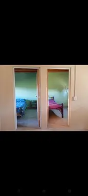 a view of a room with a bed and a window at El Crespín in San Lorenzo