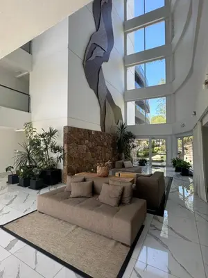 a living room with a couch in a building at Departamento en Veneto Village in Villa Parque Siquiman