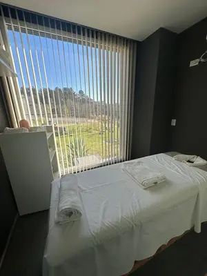 a bedroom with a bed and a large window at Departamento en Veneto Village in Villa Parque Siquiman