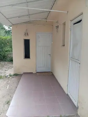 an empty room with a door and a porch at Casa en Tanti in Tanti