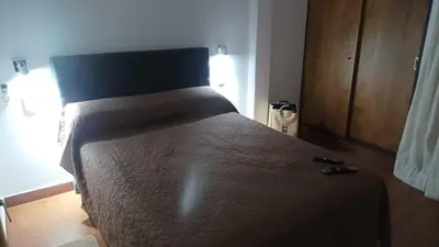 a bedroom with a bed in a room at Villa Haus in Villa Carlos Paz
