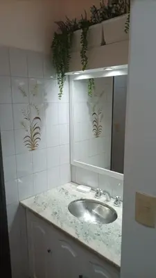 a bathroom with a sink and a mirror at Villa Haus in Villa Carlos Paz