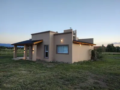 a small house in the middle of a field at Casa Merlo San Luis Barrio privado Solares del Valle in Merlo