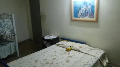 a bedroom with a bed with a banana on it at Sierras de Córdoba in Santa María