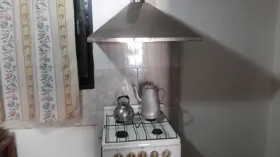 a tea kettle on a stove in a kitchen at Sierras de Córdoba in Santa María